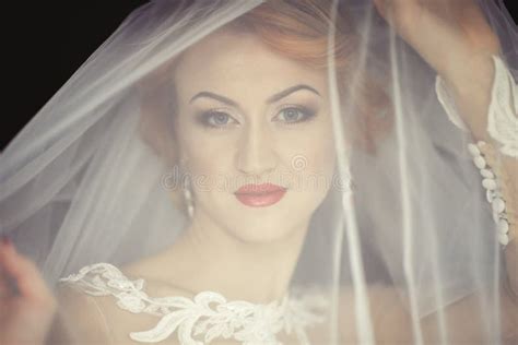 Beautiful Bride Portrait With Veil Over Her Face Wearing Professional