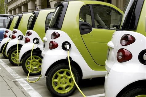 Premium Photo | Compact Electric Cars Charging in a Row The Future of ...