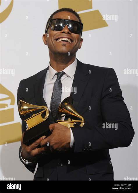 Maxwell holds his two awards at the 52nd annual Grammy Awards at the ...