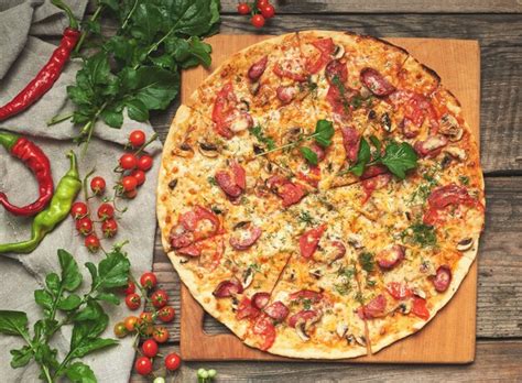 Premium Photo Baked Round Pizza With Smoked Sausages Mushrooms Tomatoes