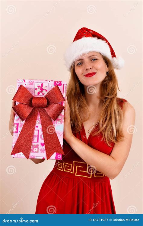 Christmas Sensual Girl With A Present Box Dressed In Santa Costume