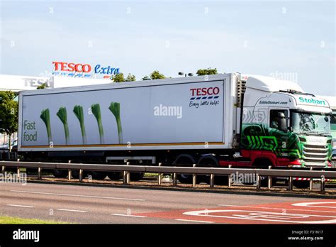 Tesco Articulated Lorry Travelling Past The Tesco Extra Supermarket