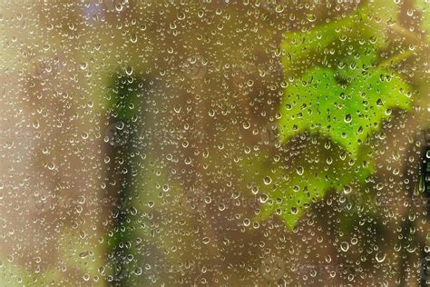 raindrops on window pane during night rain 11372803 Stock Photo at Vecteezy