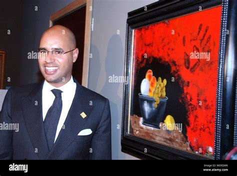 Saif Islam Gaddafi, son of Libyian leader Muammar Al-Gaddafi, opens his painting exhibition in ...