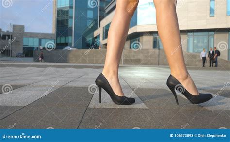 Female Legs in High Heels Shoes Walking in the Urban Street. Feet of ...