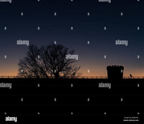 Silhouette Couple Kissing at Sunset Stock Photo - Alamy