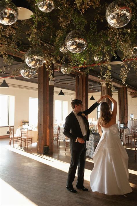 Ceiling Greenery Wedding Flowers And Disco Balls For The Reception Of A