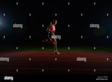 Athletic Woman Running On Track Stock Photo Alamy