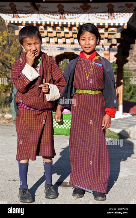 Boy and Girl wearing Gho and Kira national dress Bhutan Stock Photo - Alamy