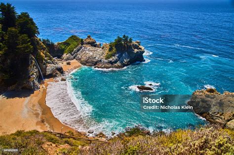 Ocean Cove Leads To Sandy Beaches And Secret Waterfall Stock Photo