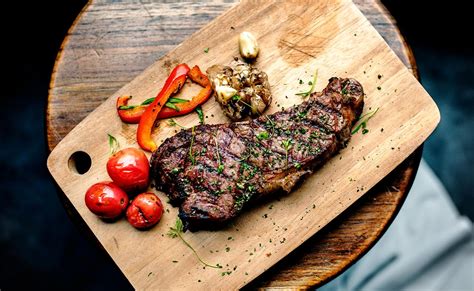 Grilled Steak On Wooden Plate Royalty Free Stock Photo 87699