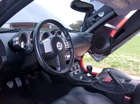 Silver Carbon Fiber On Armrest And Control Panels Painted On Doors