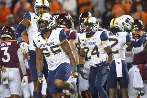 Jacolby Spells' pick-6 pushes WVU past Virginia Tech 33-10 to keep