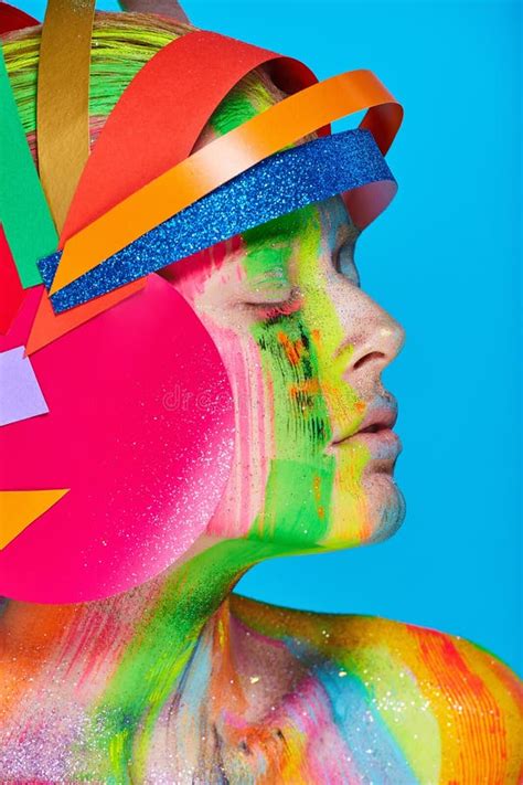 Model With Colorful Abstract Makeup In Multicolored Helmet Stock Image