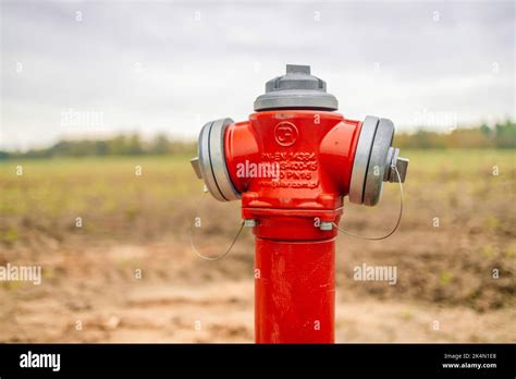 Pipe fittings in the form of a fire hydrant in red close-up with copyspace Stock Photo - Alamy