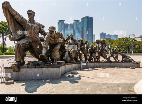 Monument With Fighting Soldiers Company In War Memorial Of Korea For