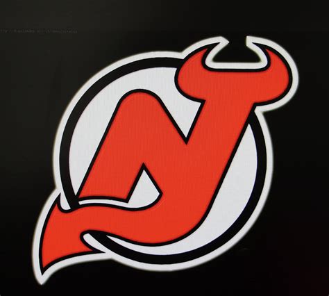 New Jersey Devils Logo - Red on Black Photograph by Allen Beatty - Fine ...