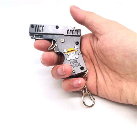 One Piece Mini Folding Metal Rubber Band Launcher Gun – Music Chests