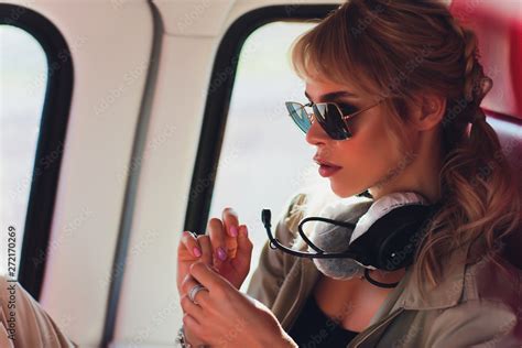 Female pilot in cockpit of helicopter before take off. Young woman helicopter pilot. Stock Photo ...