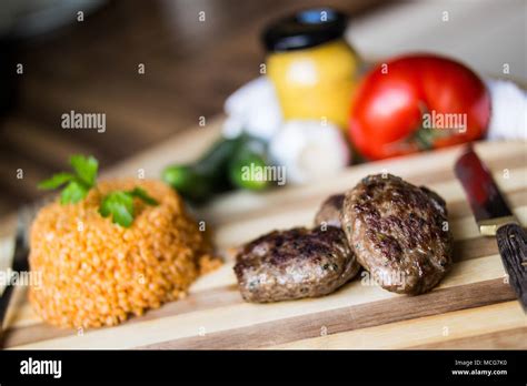 Turkish Meatball Kofte Or Kofta With Pliav Bulgur Pilaf Tomatoes And