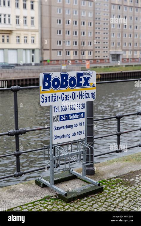 Small bike rack or stand with advertisement in Berlin, Germany Stock Photo - Alamy