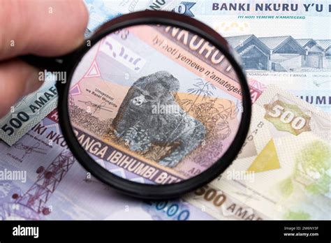 Rwandan franc in a magnifying glass Stock Photo - Alamy