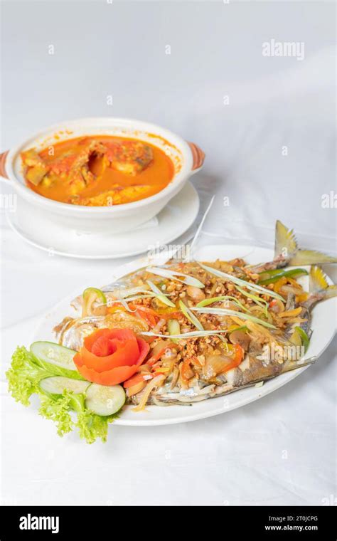 Steamed Pompano Or Kuwe Fish With Sweet And Spicy Sauce And Beautiful