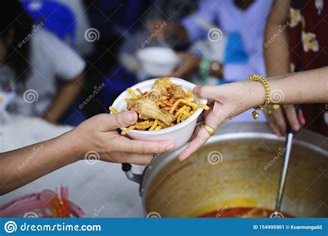 Charity Food Is Free For People In Slums Hands Of Volunteers Serves