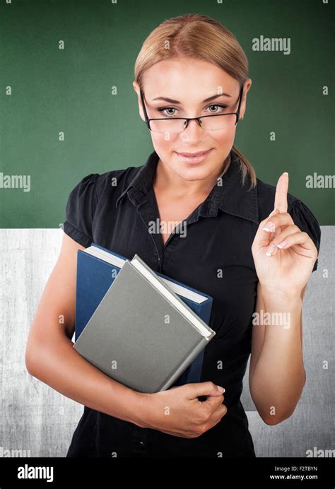 Portrait Of Young Confident Business Woman Wearing Glasses And Holding