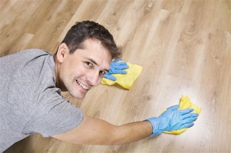 Close Up Of Cleaning Young Man With Blue Protectiv Gloves Top View