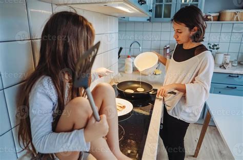 happy family cook together in the kitchen 11368918 Stock Photo at Vecteezy