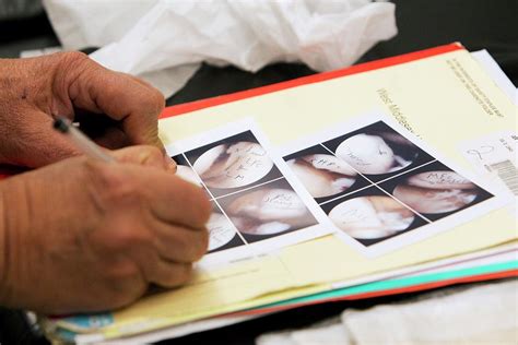 Surgeon Writing Notes Photograph By Mark Thomas Science Photo Library