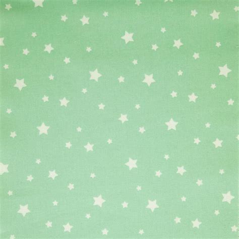 Tela estrellas blancas sobre fondo verde mint Mercería Adelka Canarias