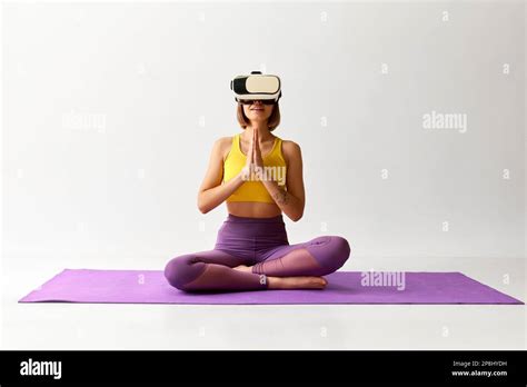 Flexible Sportive Young Girl Doing Yoga Exercises In Vr Headset Glasses