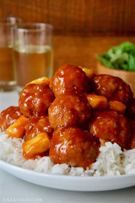 Baked Sweet And Sour Meatballs With Pineapple On Top Of White Rice In A White Bowl Sweet And