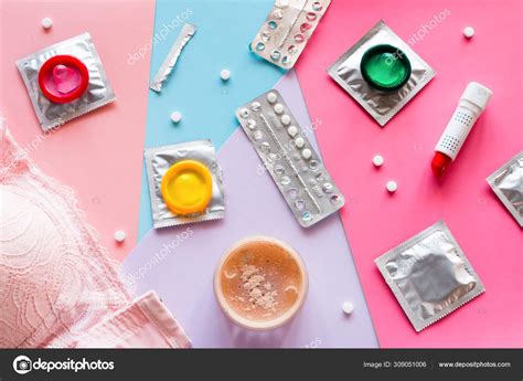 Cosmetics Bra Condoms Birth Control Pills Colored Background Concept