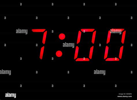 Digital clock closeup displaying 7:00 o'clock Stock Photo: 128889240 - Alamy