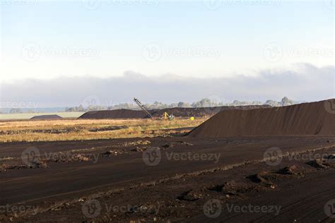 extraction of peat 9511551 Stock Photo at Vecteezy