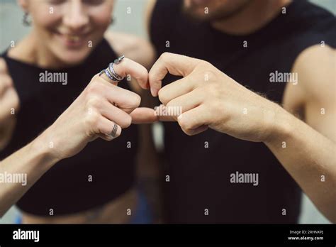 Couple in love shows a heart with their hands Stock Photo - Alamy