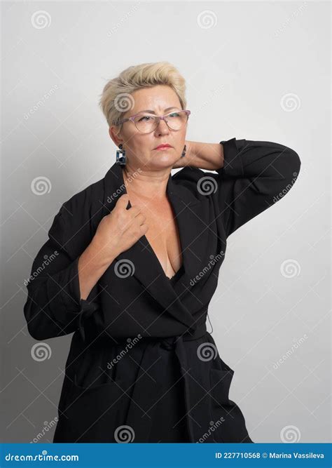 Adult Woman With Short Hair Blonde With Glasses Posing At The Camera