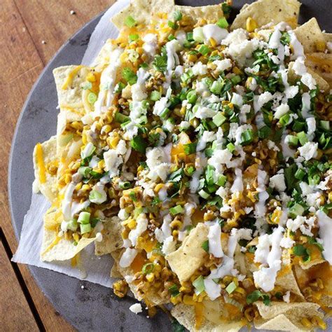 Cheesy Tortilla Chips Topped With Creamy Roasted Corn Queso Fresco