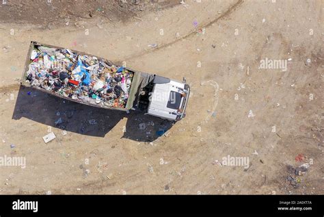 Garbage truck at landfill hi-res stock photography and images - Alamy