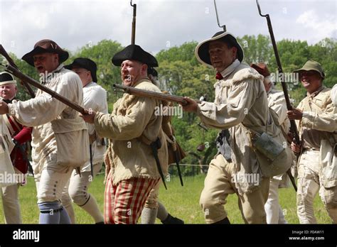 Continental Army soldiers with muskets in Revolutionary War reenactment ...