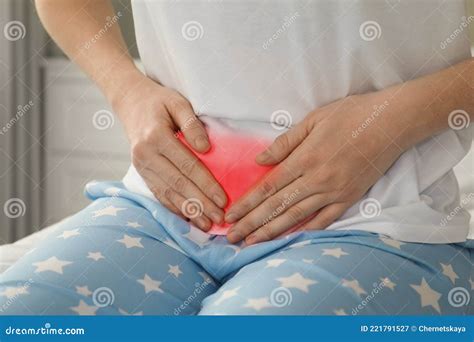 Woman Suffering From Abdominal Pain At Home Closeup Stock Image