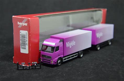 Herpa Volvo FH16 GL Koffer Hängerzug Vögele 1 87 Acheter sur Ricardo