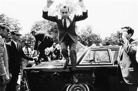 President Richard Nixon Jumps Off The Trunk Of His Limousine In Lahore