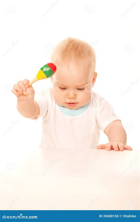 Baby Knocking His Rattle On The Table Stock Photo Image 28408150