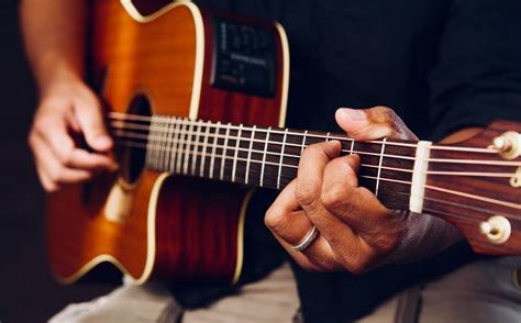 Photo Of Person Playing Acoustic Guitar · Free Stock Photo