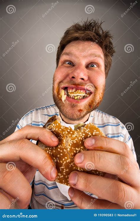 Man Chewing Hamburger Stock Photos - Image: 19390583