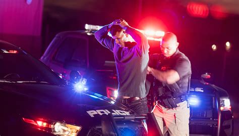 Police Officer Making An Arrest Stock Photo - Download Image Now - iStock